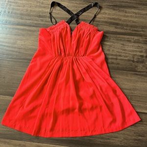 LULUVIA red-orange dress with black beaded criss-cross neckline